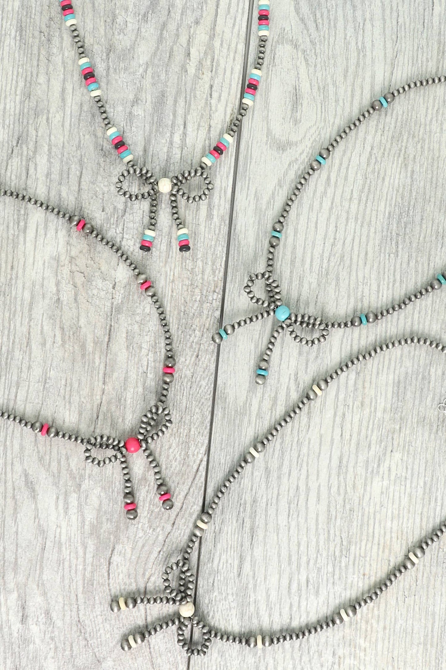 Western Marbled Pearl Bead Long Tail Bow Necklace: Ivory