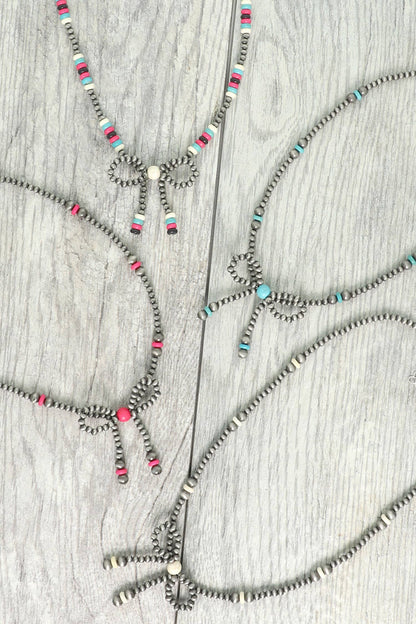 Western Marbled Pearl Bead Long Tail Bow Necklace: Ivory